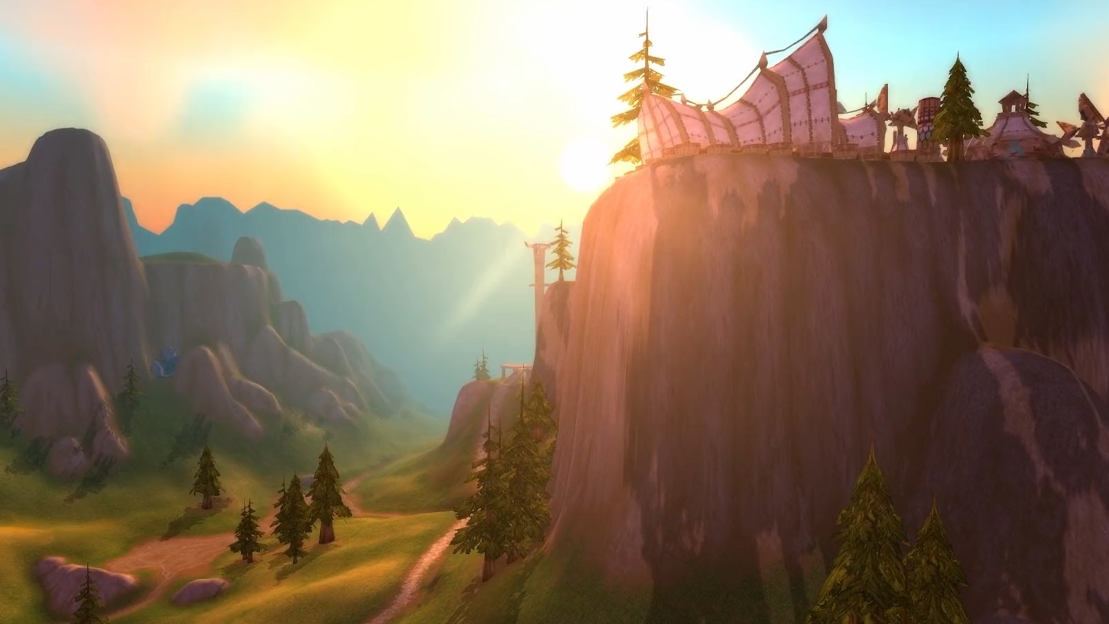 Mulgore — Meseta de Mulgore con construcciones tauren: la montaña proyecta ahora sombras y rayos de luz sobre la bruma. — Classic